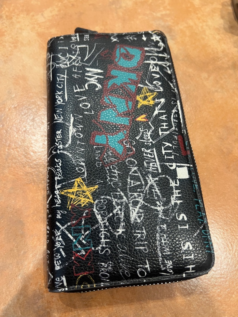 DKNY Black Graffiti Print Zip Around Wallet with Teal & Yellow Accents